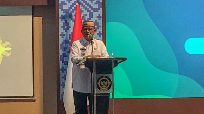 Bupati Bone Bolango, Ismet Mile saat memberikan sambutan di agenda penyerahan LHP BPK