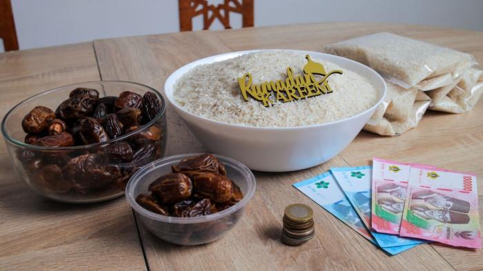 RAMADAN 2026 - Ilustrasi zakat fitrah - BAZNAS menetapkan zakat fitrah 2026 sebesar Rp50.000 per orang. Simak ketentuan, cara hitung, waktu bayar, hingga fidyah resmi tahun ini.