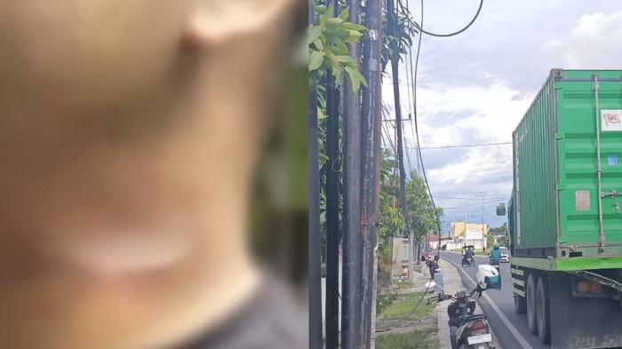 KORBAN KABEL -- Potret pengendara motor terjerat kabel di jalanan. Yanser Achir terlilit kabel di depan Kantor Dinas Kelautan, Perikanan, dan Pertanian Kota Gorontalo, Selasa (13/1/2026).