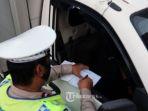 ilustrasi-polantas-polisi-lalulintas.jpg