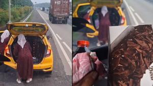 Sopir-truk-bantu-ganti-ban-mobil.jpg