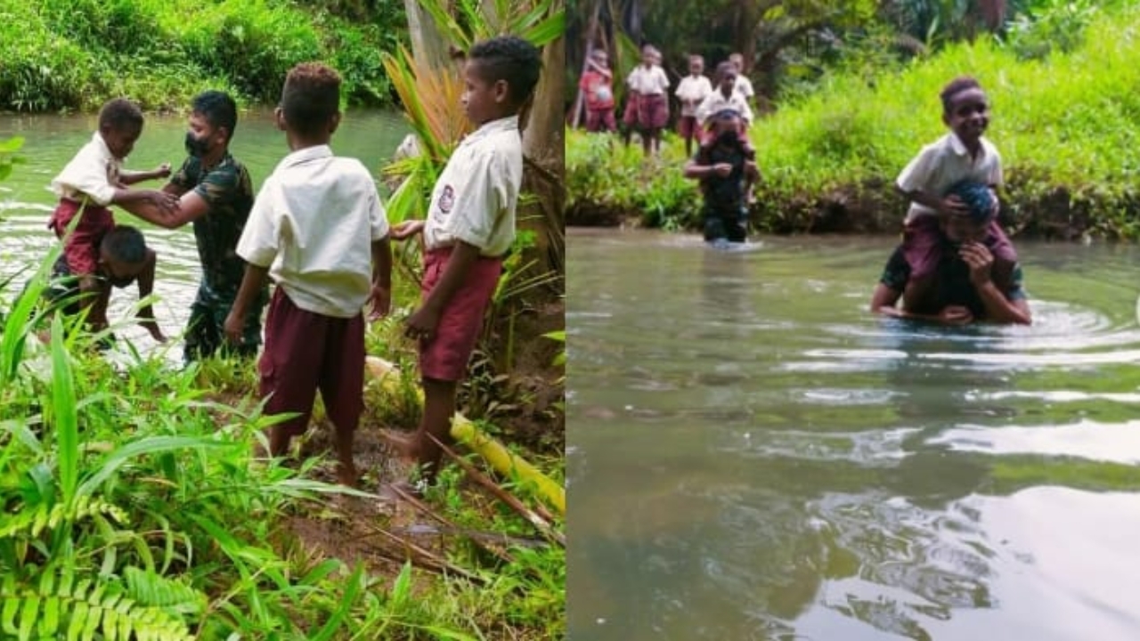 prajurit-tni-membantu-sebrangi-sungai.jpg