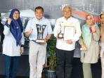 Penjabat-Bupati-Purwakarta-Benni-Irwan-Kadisdukcapil-Purwakarta-Muhamad-Husni.jpg