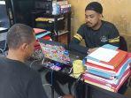 Salah-satu-tersangka-pengrusakan-rumah-sukabumi.jpg