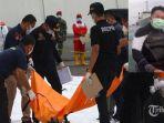 petugas-mengidentifikasi-kantong-jenazah-korban-jatuhnya-pesawat-sriwijaya-air-sj182_.jpg