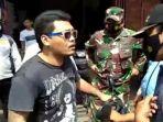 seorang-pria-menolak-sanksi-razia-masker-saat-petugas-gabungan.jpg