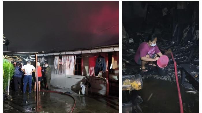 ASRAMA POLISI TERBAKAR -  Salah satu warga saat membantu proses pendinginan dengan ember dan gayung usai kebakaran di Asrama Polri Ciledug Tangerang, Kamis (16/4/2026).