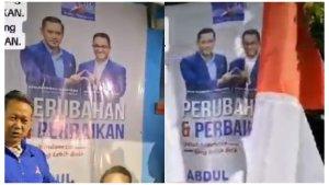 Kader-Partai-Demokrat-Kota-Bekasi-menurunkan-spanduk-bergambar-Anies-Baswedan.jpg
