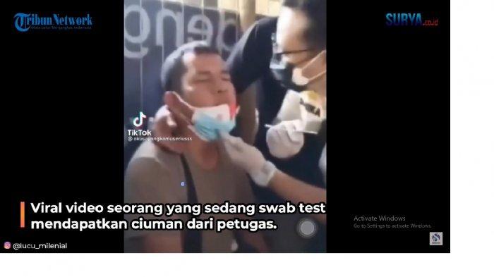 petugas-cium-pria-swab-test.jpg