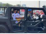 Dua-orang-petugas-paskibra-sedang-duduk-di-kendaraan-taktis-Si-Maung.jpg