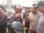 Insiden-adu-mulut-terjadi-antara-sekuriti-dengan-pengacara-warga-eks-Kampung-Bayam.jpg