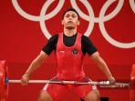 atlet-indonesia-eko-yuli-irawan-bertanding-dalam-kompetisi-angkat-besi-61kg-1.jpg