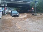 banjir-di-jalan-kh-noer-ali-kalimalang.jpg