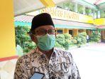 kepala-sman-86-jakarta-sunaryo-saat-diwawancarai-terkait-temuan-kasus-covid-19-di-sekolah.jpg