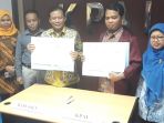 penandatangan-mou-antara-ketua-kpai-susanto-dan-ketua-bawaslu-abhan_20180320_171101.jpg