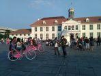 pengunjung-yang-berwisata-di-taman-fatahillah-kota-tua-jakarta-barat-rabu-562019.jpg