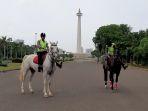 polisi-sedang-menunggangi-kuda-jenis-asal-eropa.jpg