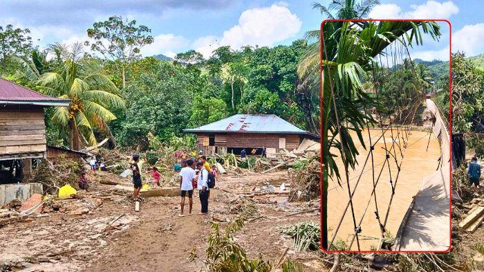 BANJIR DI MERANGIN - Penderitaan warga di wilayah terdampak banjir bandang Kecamatan Tiang Pumpung, Kabupaten Merangin, Provinsi Jambi kian bertambah. Hal itu pasca terjangan air bah yang melanda Desa Rantau Limau Kapas dan Desa Baru Sungai Sakai pada Sabtu malam lalu. Banjir tersebut membuat infrastruktur vital berupa jaringan listrik dan sinyal telekomunikasi dilaporkan terputus total.