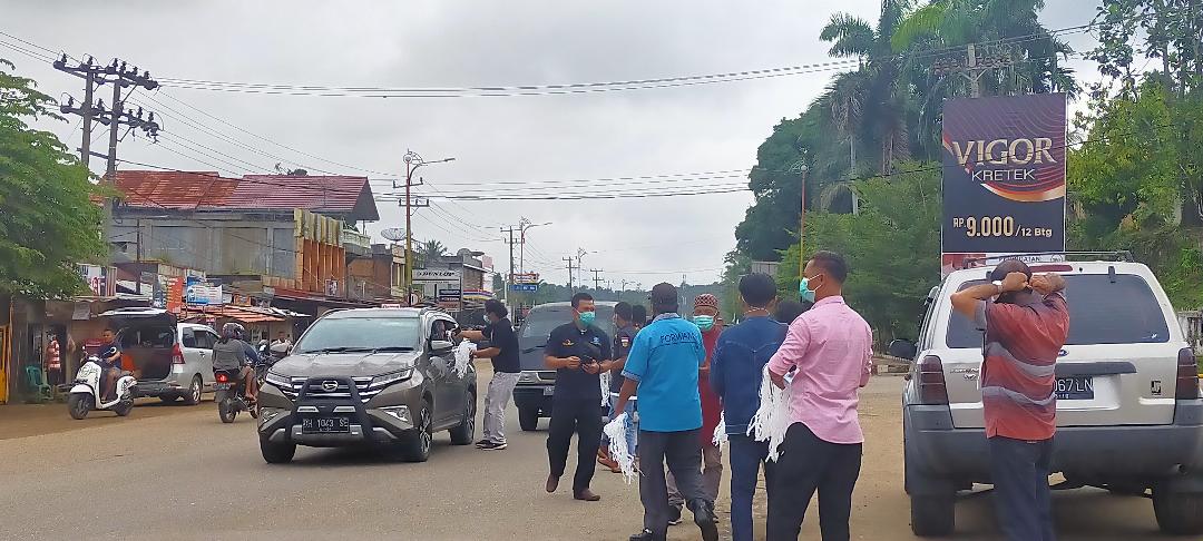 HPN 2021, Forum Wartawan Merangin Bagikan 1.000 Masker Gratis ke Pengendara Motor dan Mobil