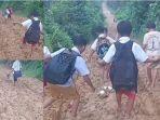 20250126-anak-anak-lewati-jalan-rusak-di-Bungo-Jambi.jpg