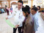 Bachyuni-Deliansyah-serahkan-sertipikat.jpg