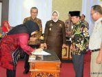 bupati-masnah-tandatangani-nota-kesepahaman-pemkab-dan-bpn-serta-kejati-jambi.jpg