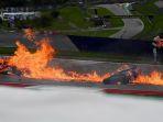motor-daniel-pedrosa-dan-lorenzo-savadori-terbakar.jpg