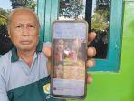 Ayah-Oshima-Yukari-Soni-saat-menunjukkan-foto-mendiang-anaknya-di-Kendal.jpg