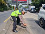 CAT-JALAN-Anggota-Satlantas-Polres-Pekalongan-2345.jpg