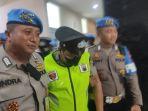 Dua-polisi-pemeras-keluar-sidang-dari-ruangan-sidang-etik-di-Polda-Jateng.jpg