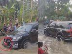 Kolase-Mobil-Dinas-Terobos-Genangan-Air-saat-Protes-Warga.jpg