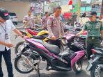 Polisi-saat-menyita-24-sepeda-motor-yang-ditemukan-menggunakan-knalpot.jpg
