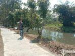 Sebuah-jalan-yang-melintasi-Pintu-Air-Lima-Rolak-Kali-Amprong.jpg