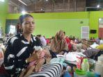 Siti-Solikhah-22-ibu-muda-korban-banjir-dari-Karanganyar-Demak.jpg