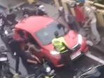 Sosok-pengemudi-Honda-Brio-ugal-ugalan-hingga-menabrak-anggota-polisi-akhirnya-ditangkap.jpg
