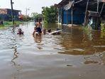 Tanggul-jebol-membuat-tigbanjir-rob.jpg