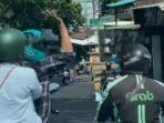 Viral-di-media-sosial-pengendara-sepeda-motor-memukul-driver-ojek-online.jpg