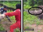 anjing-dilempar-ke-buaya.jpg