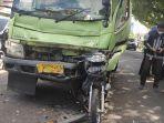 kecelakaan-truk-vs-sepeda-motor-di-Jalan-Raya-Porka.jpg