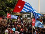mahasiswa-papua-menggelar-aksi-demonstrasi-dengan-mengibarkan-bendera-bintang-kejora.jpg