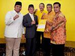 tomo-M-Ibnu-Hajar-menerima.jpg