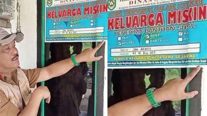 Kepala-Dinas-Sosial-Helmi-Johan-memasang-stiker-keluarga-miskin-ke-rumah-warga.jpg
