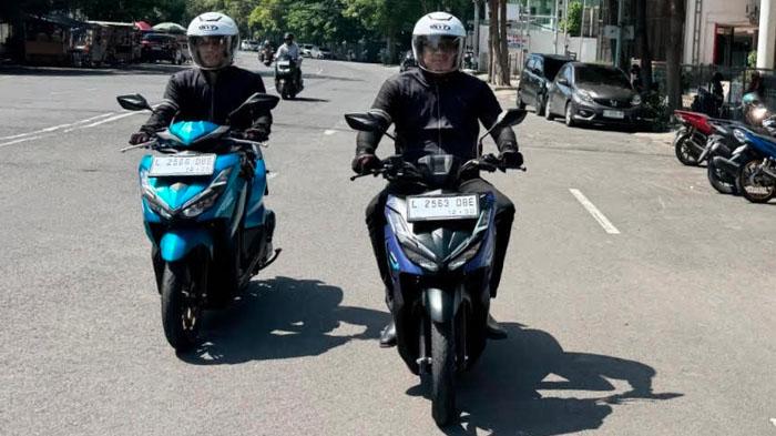 Pengendara-sepeda-motor-mempraktikkan-berkendara-aman-dan-tertib-lalu-lintas-ilustrasi-motor-honda.jpg