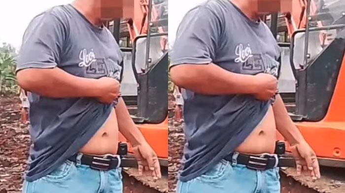 Pria-mengaku-orang-ring-satu-istana-sambil-pamer-diduga-pistol-Depok.jpg