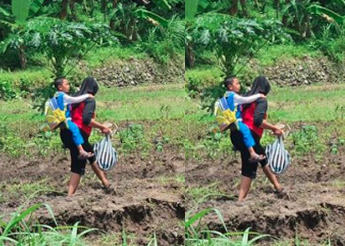 Rohmi Gendong Anaknya Pulang Sekolah Lewati Ladang Berlumpur karena Jalan Amblas: Semoga Diperbaiki
