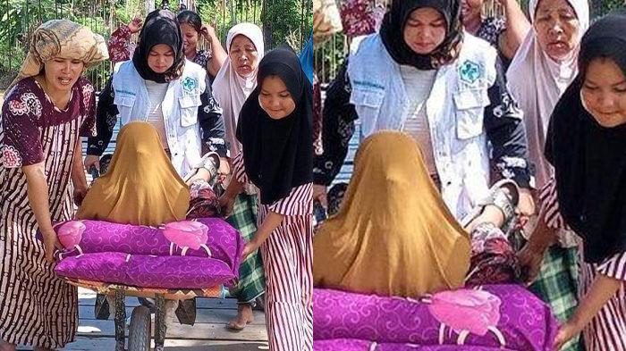bidan-dorong-gerobak-yang-angkut-ibu-hamil-hendak-melahirkan-melewati-jembatan-gantung.jpg