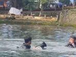 BPBD-Magetan-mencari-barang-yang-tenggelam-di-telaga-sarangan.jpg
