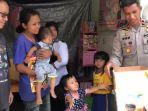 Kompol-Domingos-Ximenes-saat-memberikan-bantuan-suplemen-dan-sembako.jpg