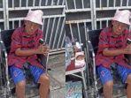Pak-Tarno-berjualan-ikan-cupang-sambil-duduk-di-atas-kursi-roda.jpg