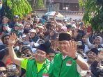 Pasangan-AMIN-saat-berada-di-Acara-Jalan-Sehat-GOR-Kaliwates.jpg